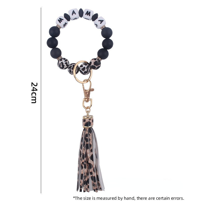 Venta al por mayor Llavero de muñeca con cuentas de estampado de leopardo de silicona